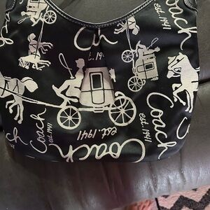 Nice clean no stains or tears . Coach hobo style bag. Carriage design.